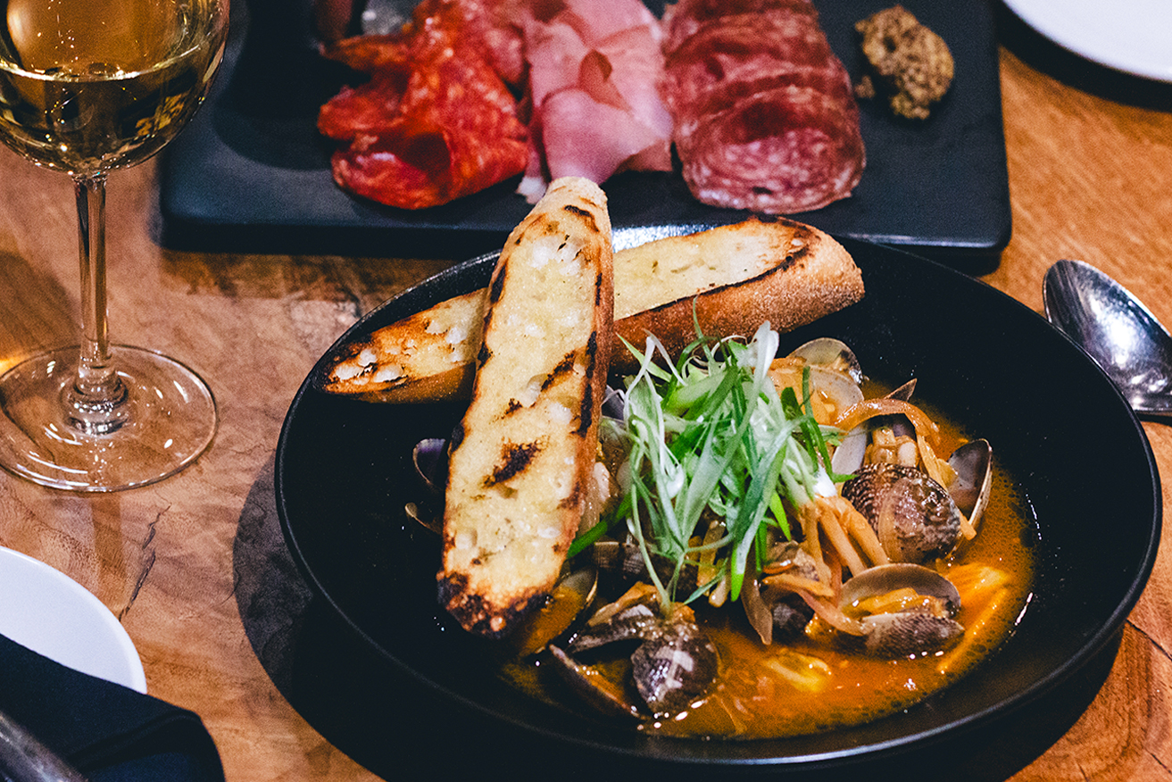 The perfect Shareable -- fresh clams served with kimchi in a delicious gochujang sake broth. – FINN