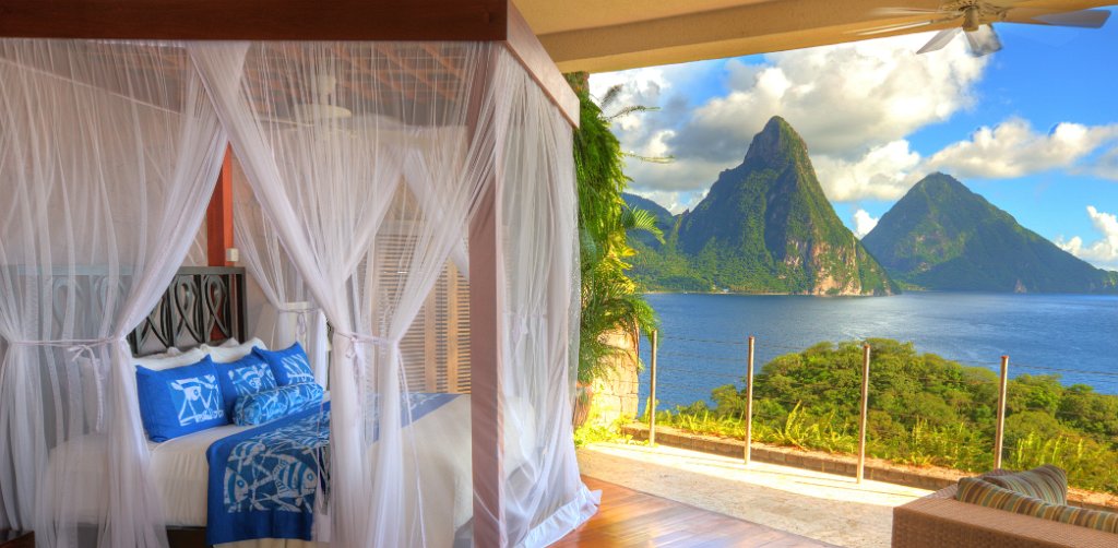 open air hotel room with ocean in background