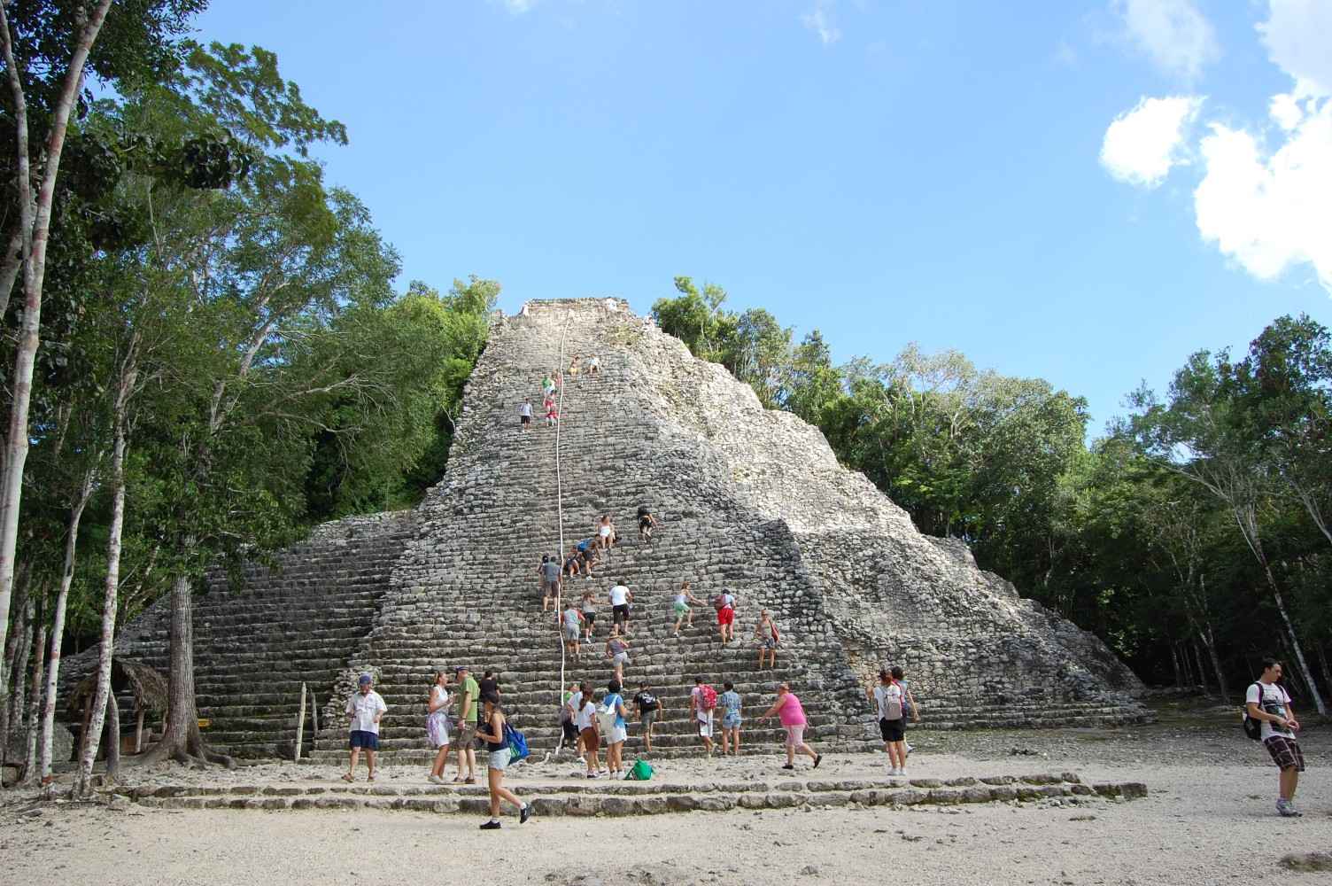 People climbing the Mayan pyramid of Coba