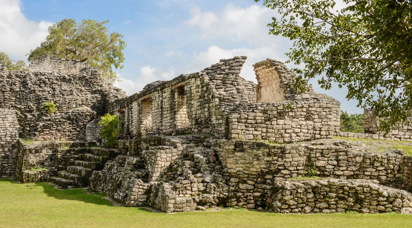 Photo of Kohunlich ruins seen from the jungle