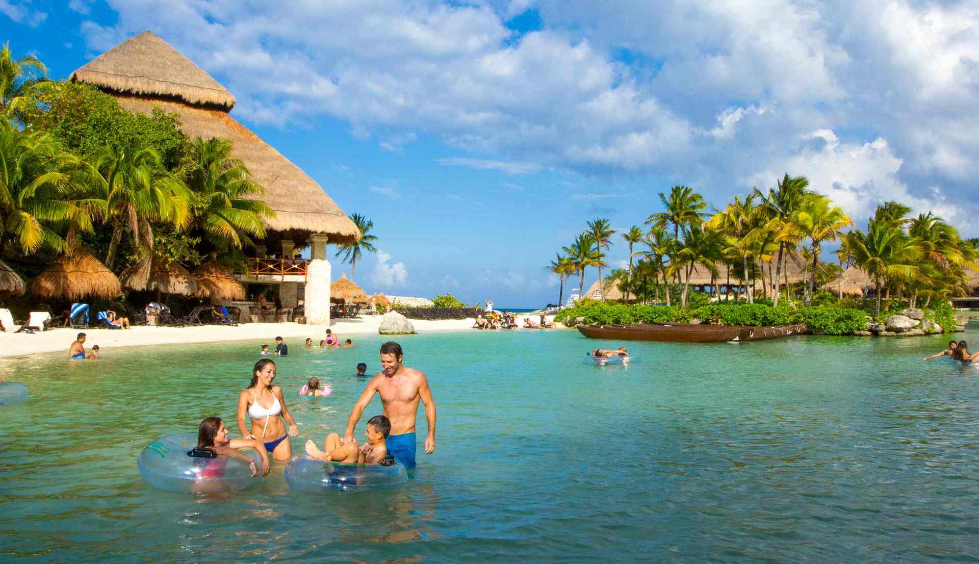 family swimming at Xcaret park