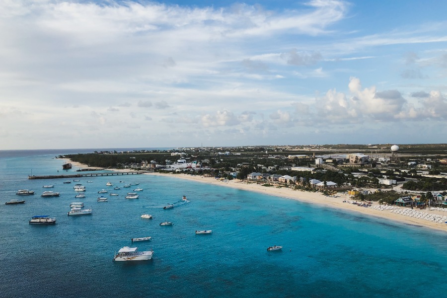 Boats floating in the blue water of the ocean are presenting a scene of natural beauty