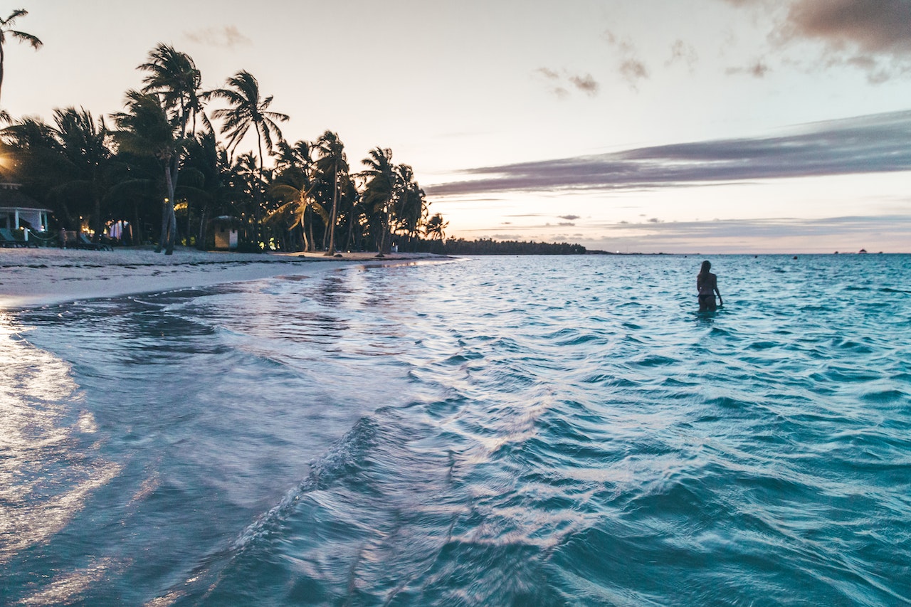 Swimming in the Caribbean Ocean at sunset.