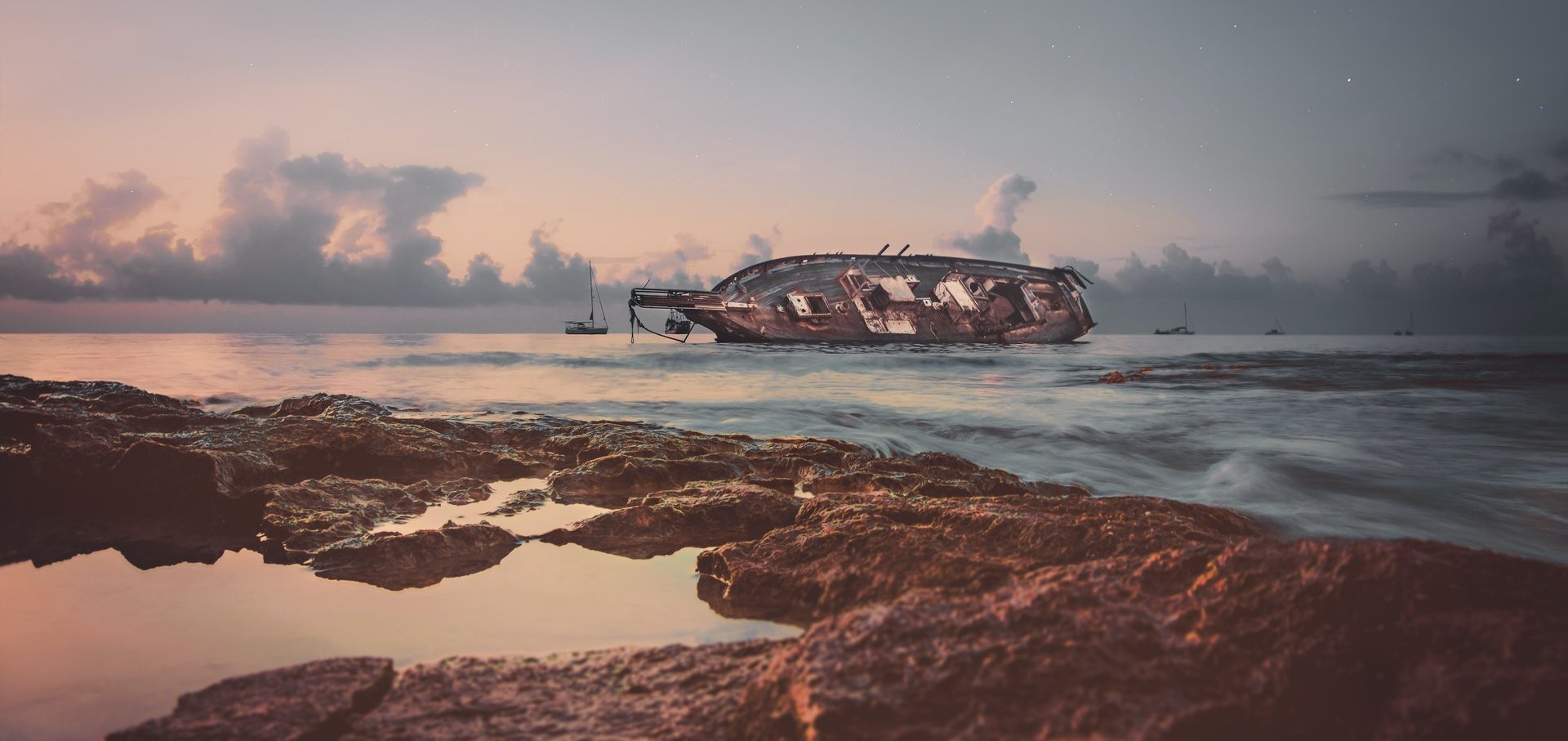 shipwreck sticking out of water