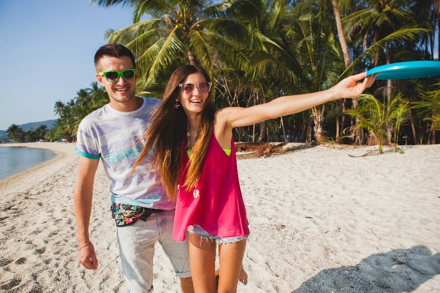 A couple is having fun on the beach