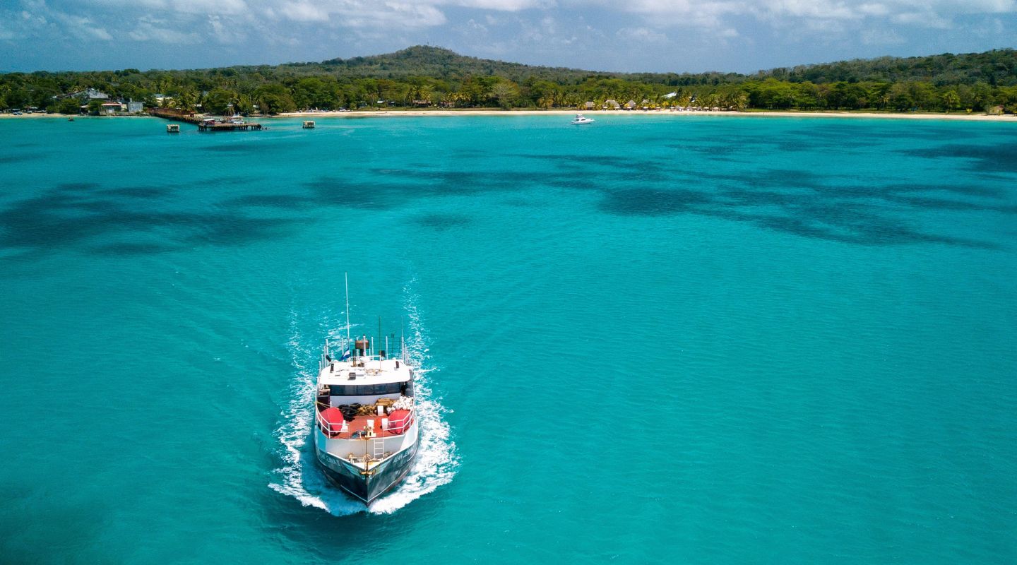 Small yatch sailing in the ocean. 