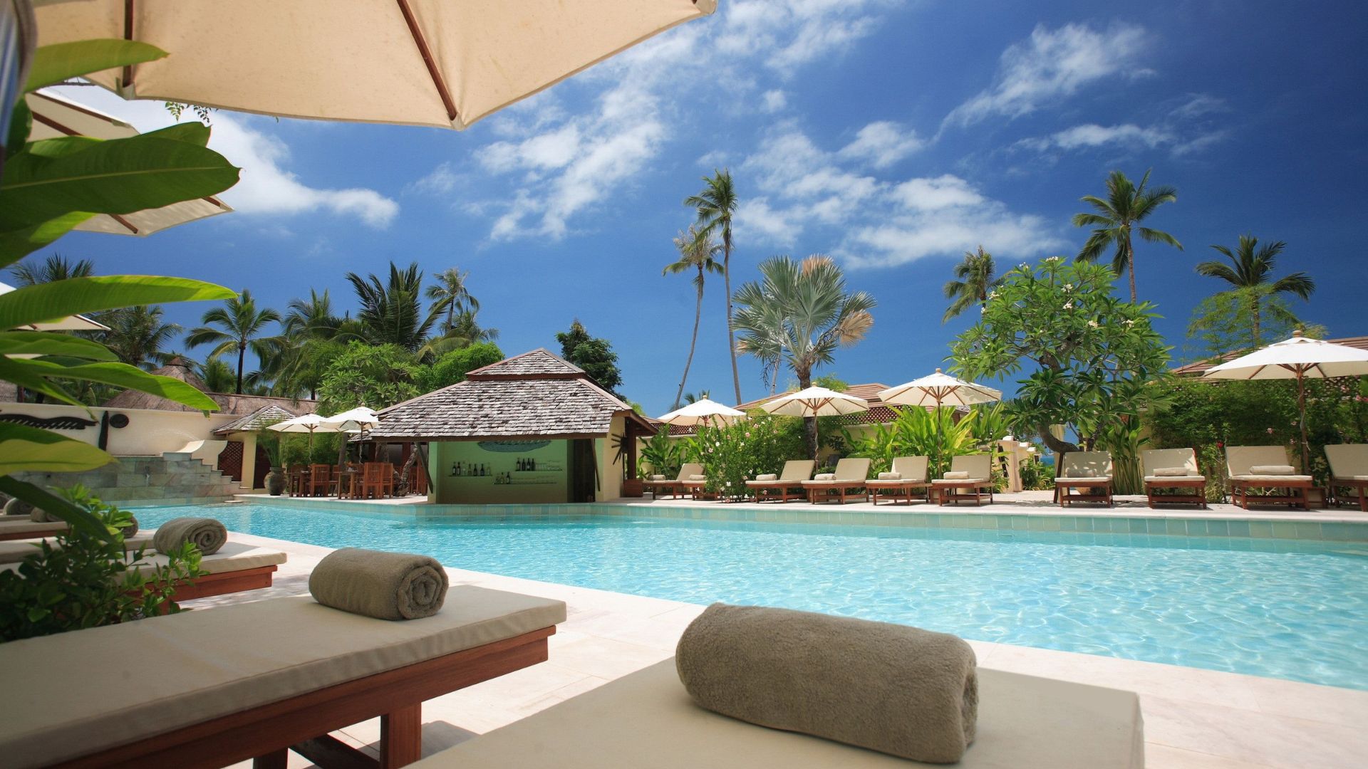 Comfortable-looking loungers next to a pool