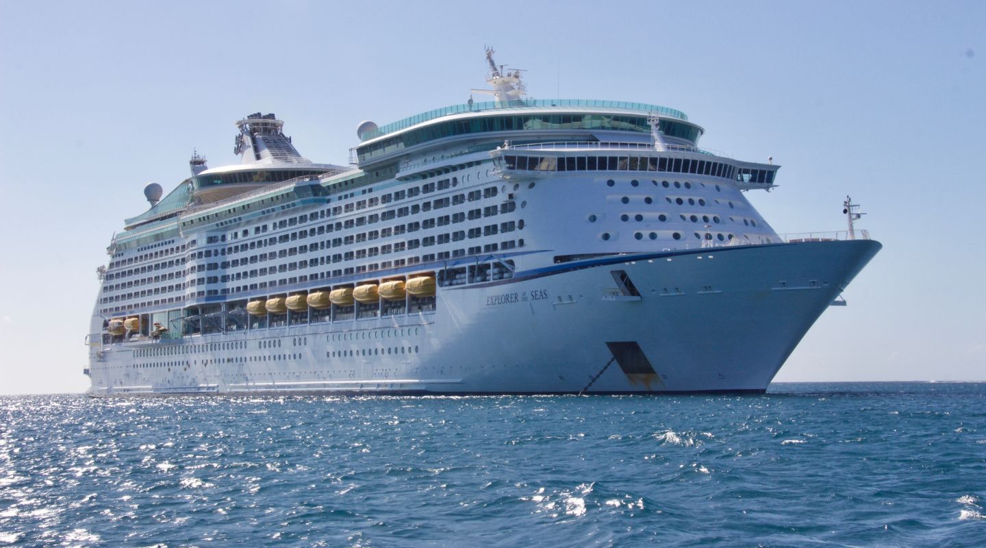 Large cruise ship sailing in the ocean.