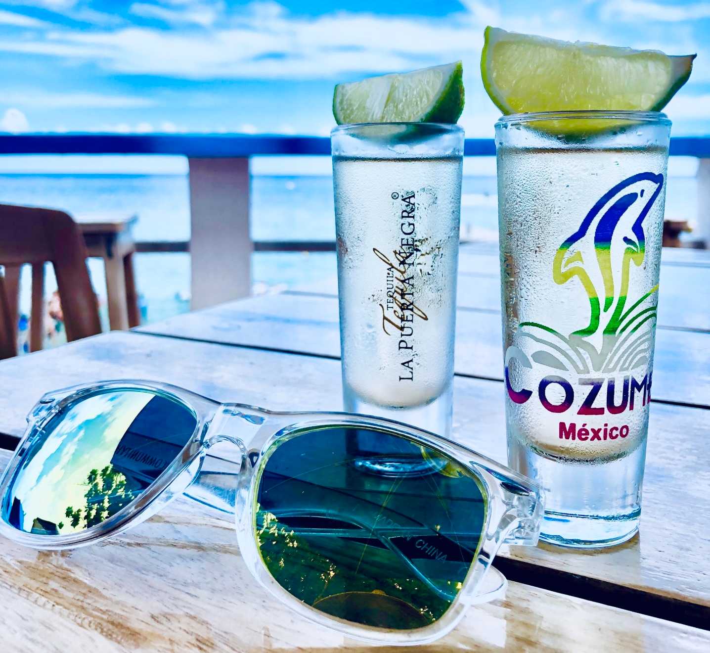 sunglasses and tequila glasses in Cozumel