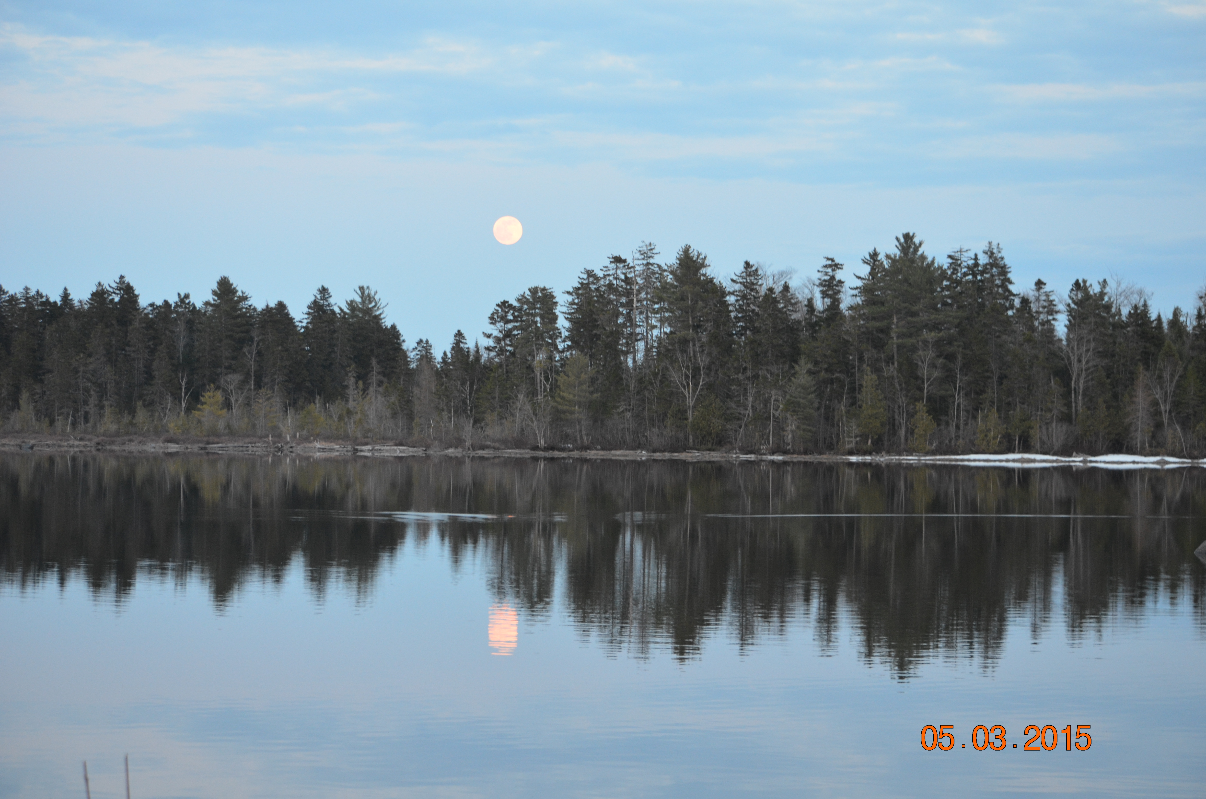 A shot of the moon, and if you look you can see snow in May.