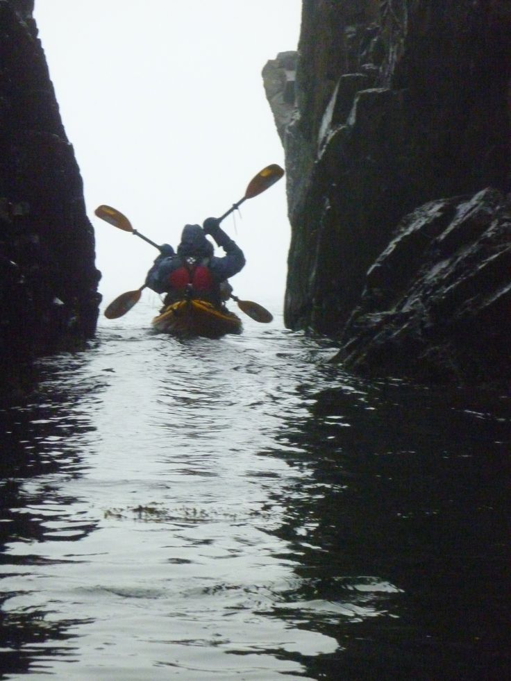 Kayaking out of a sea cave