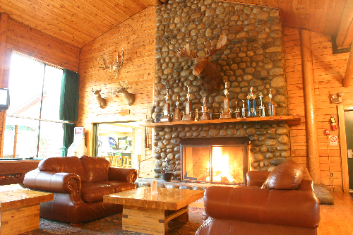 Soak in the outdoor giant hot tub or relax by the roaring fireplace back at Northern Outdoors resort after a great day of riding.