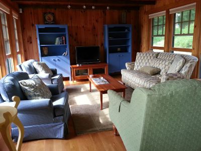 First Light Cottage - Sitting room w/TV, water views.