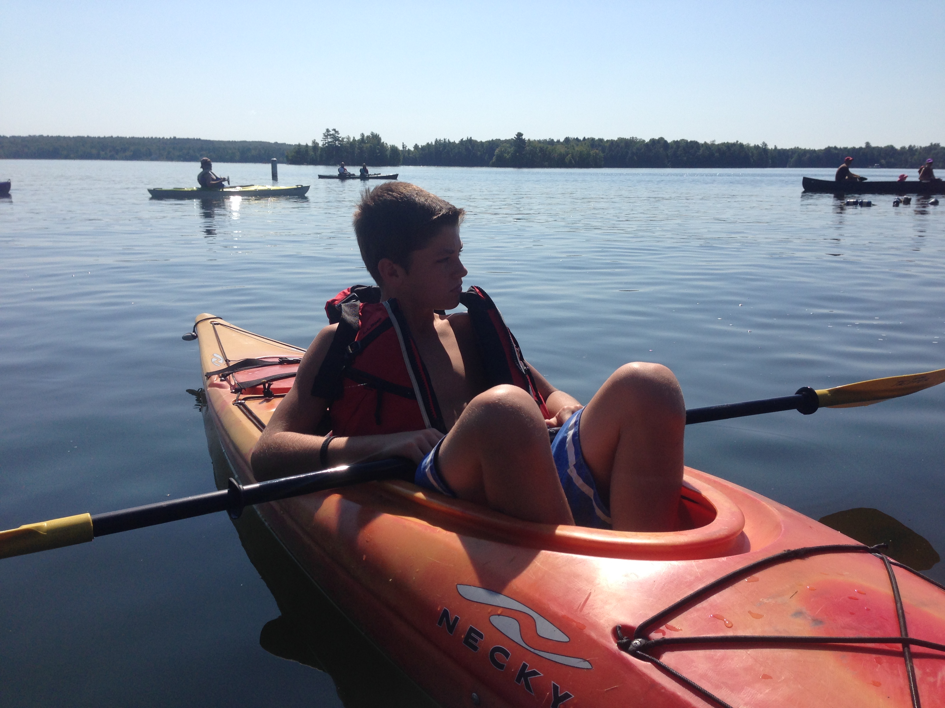 1st place in his age winning the paddle race, a few boat lengths in front of his brother!