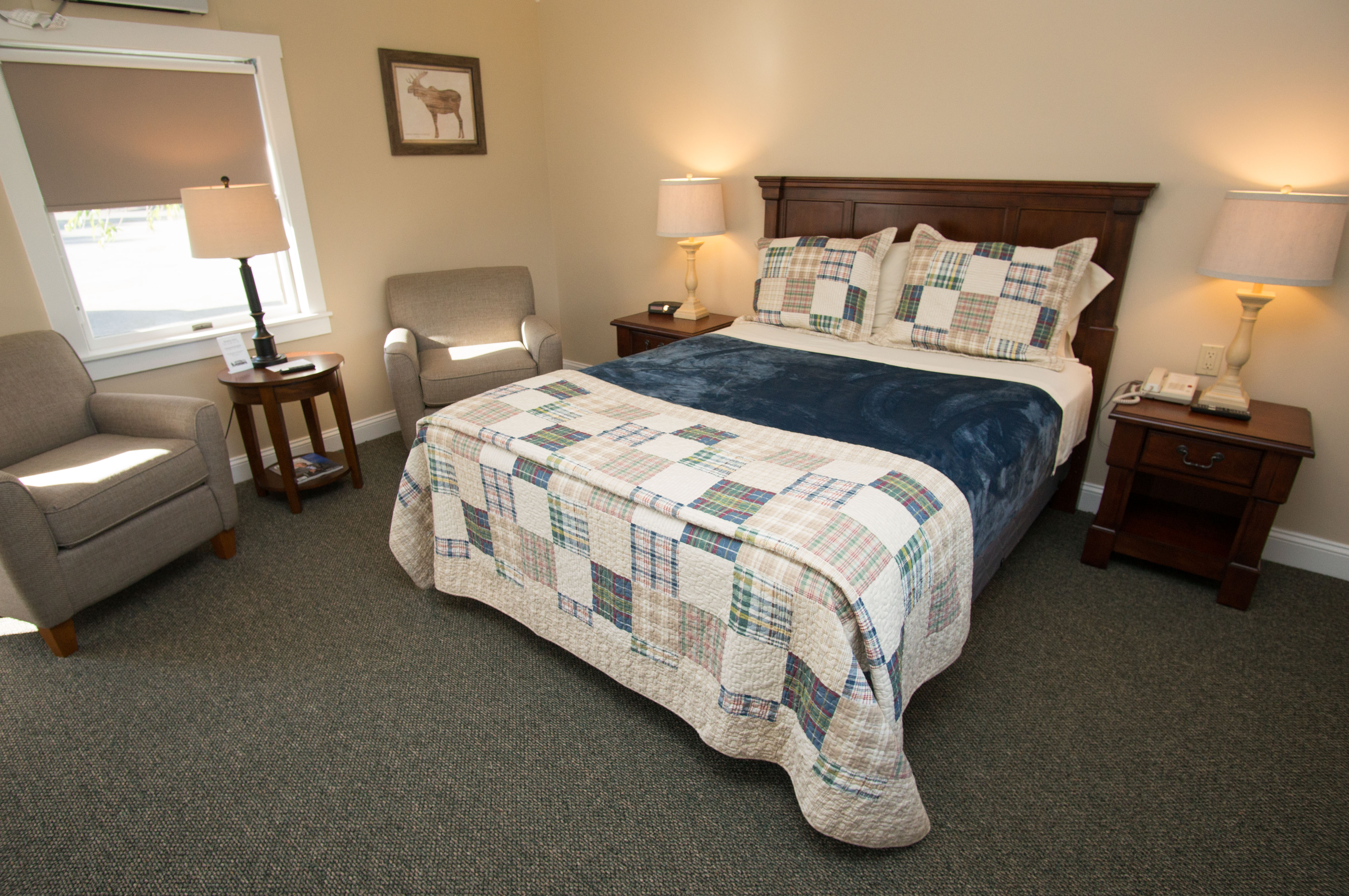 Interior of a Waterview Queen room in our Haley Pond Lodge