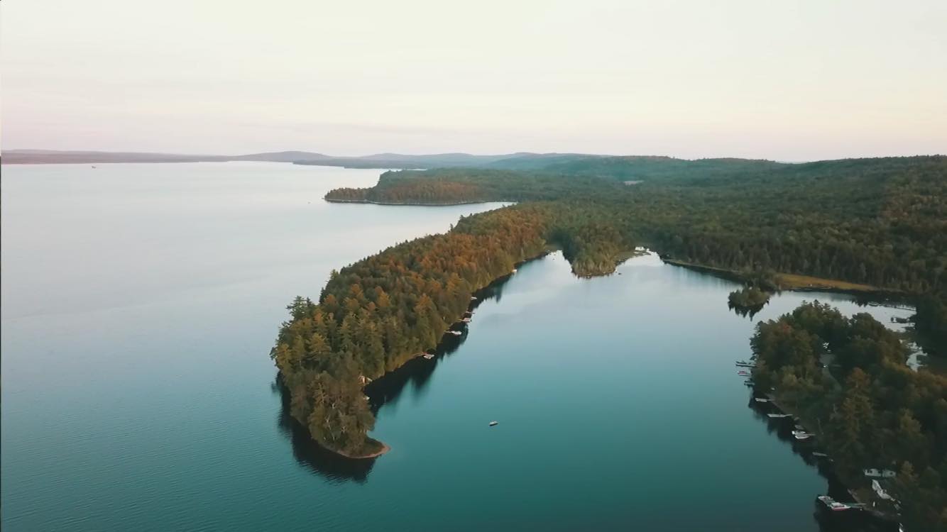 The view of a lifetime awaits, framing lakes, ponds, mountains, and New Brunswick, Canada