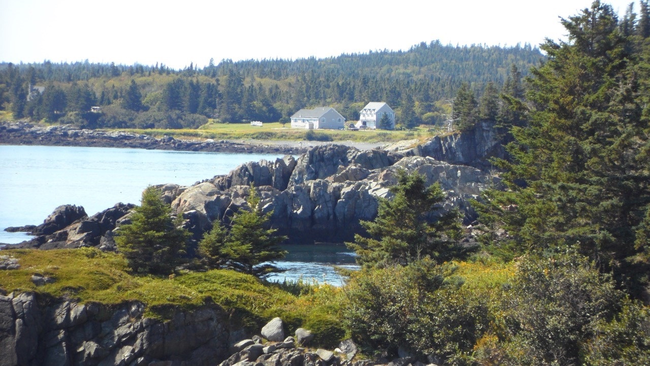 Eagles Rest is the cottage on the left closest to the shore. The owner's home is on the right.