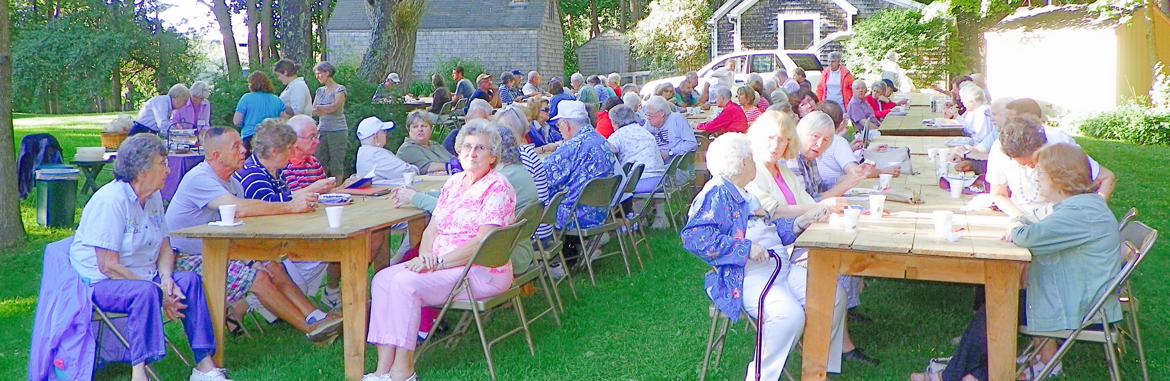 Happy people enjoying a Bean hole bean supper, aine yellow-eyed beans cooked underground the old-fashioned way - run out. Menu: beans, Kirshner hot dog, coleslaw, biscuits with real butter and a pickle or two,