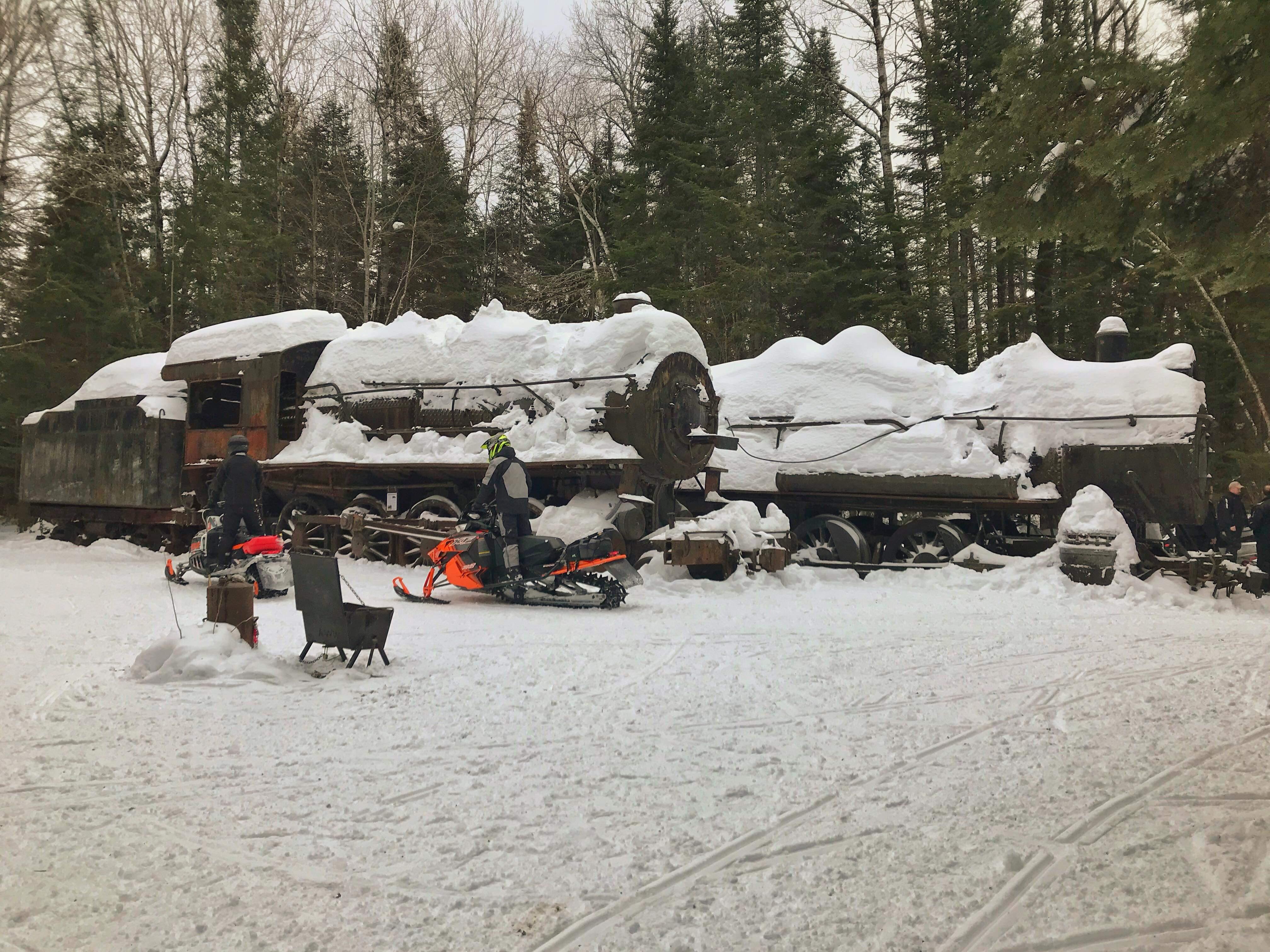 These spooky trains stand silently in the forest of Northern Maine.