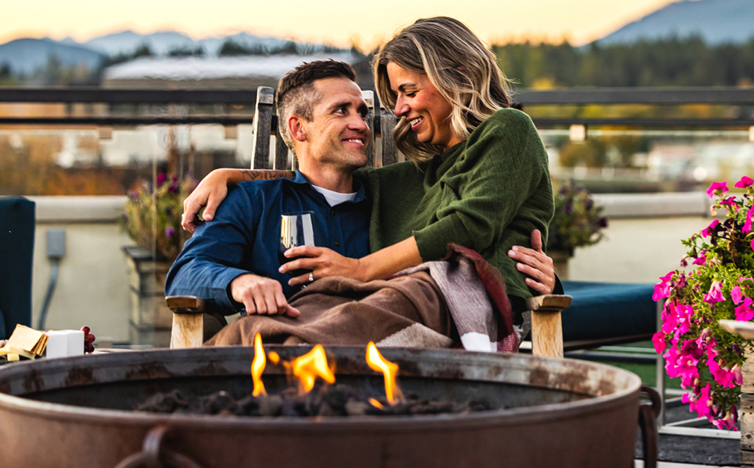 Cuddle up next to a crackling fire while you enjoy views of downtown Whitefish, Montana on the Firebrand's Rooftop Patio. – Noah Couser
