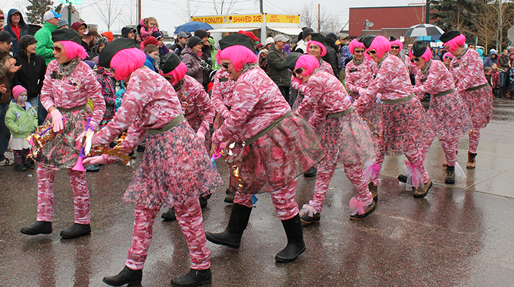 The Working Women of Whitefish entertain onlookers at the Whitefish Winter Carnival Parade in downtown Whitefish, Montana
