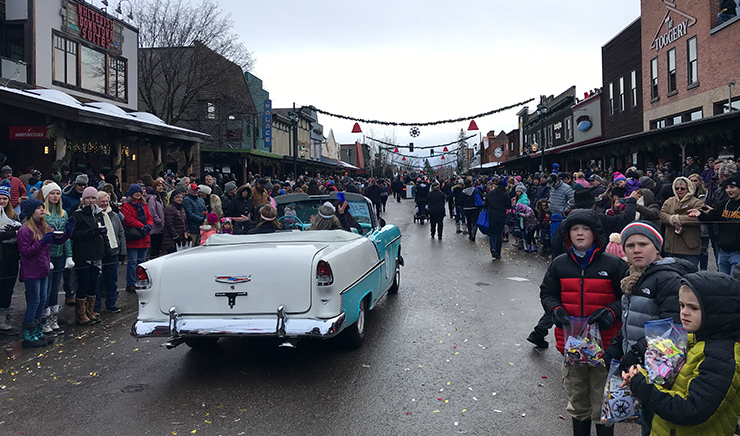 Central Avenue in downtown Whitefish is flooded with onlookers for the Whitefish Winter Carnival Parade – Dina Wood