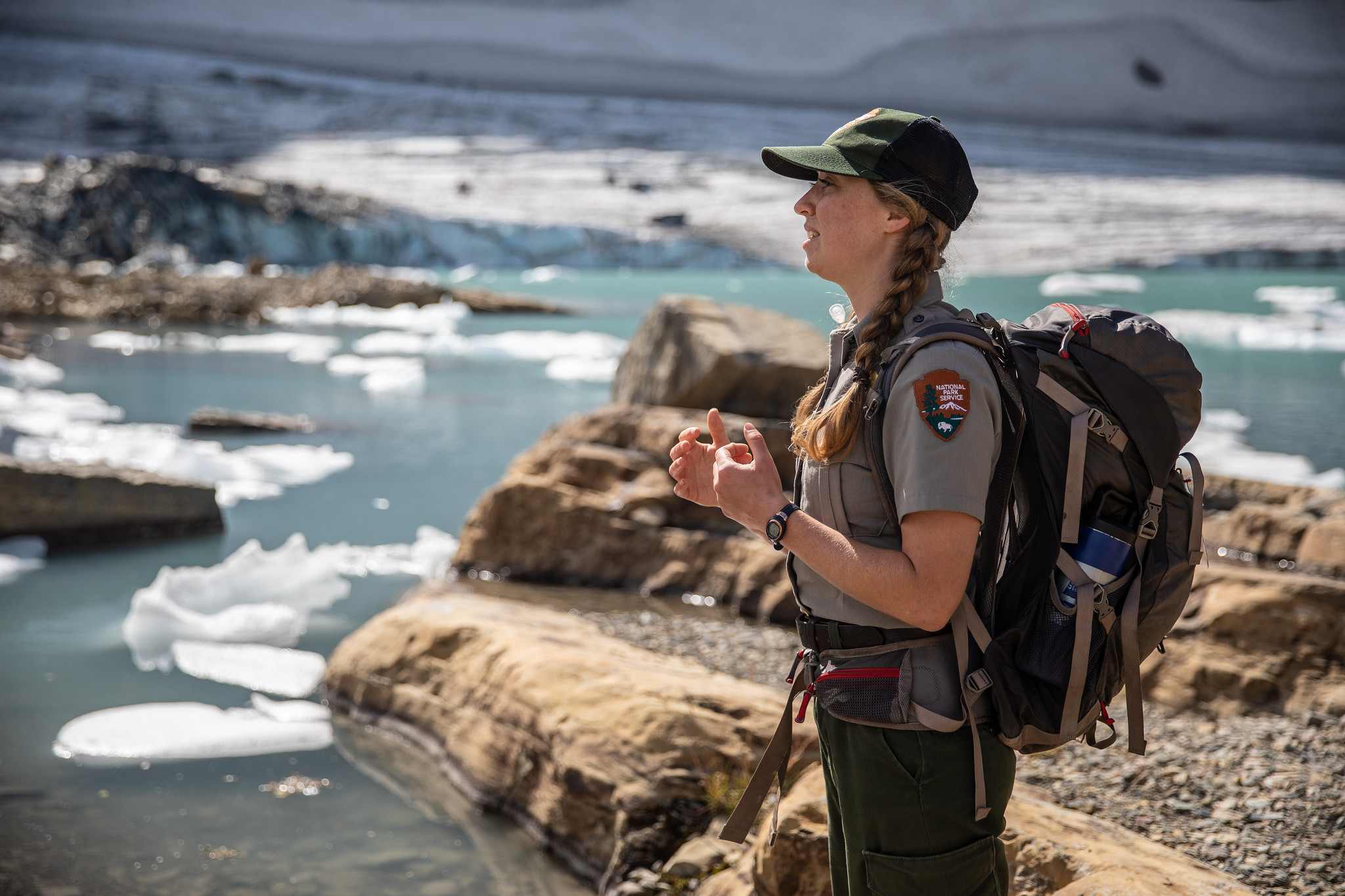 woman park ranger with lake in background