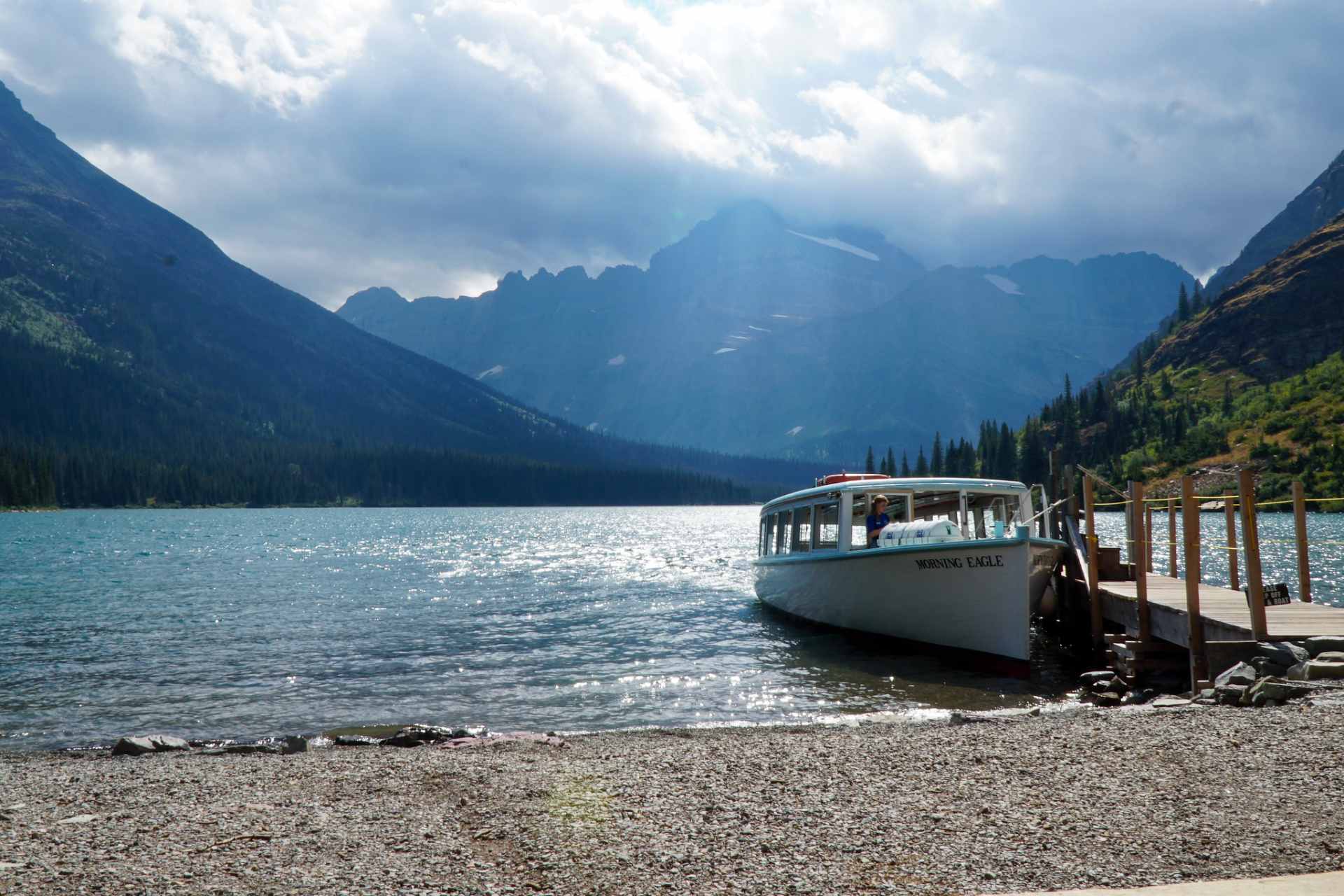 Historic tour boat on a lake shore in Glacier National Park