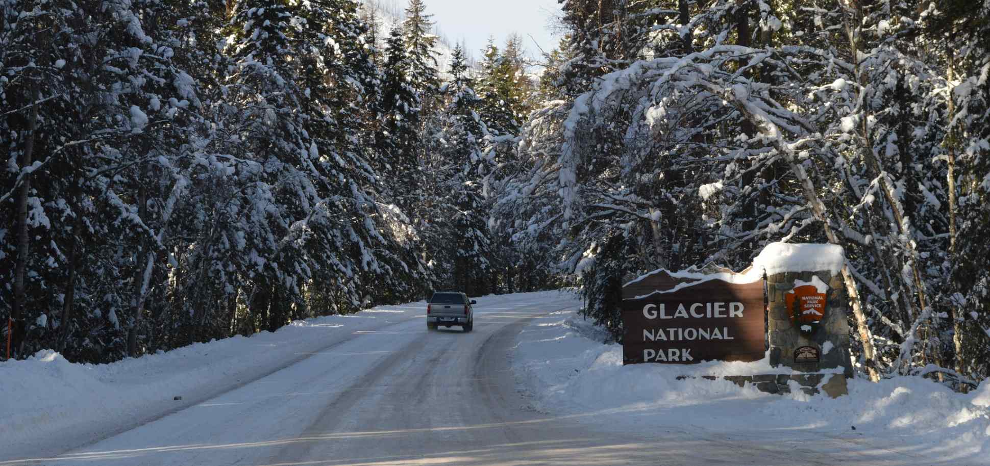 car driving into West Glacier in winter time