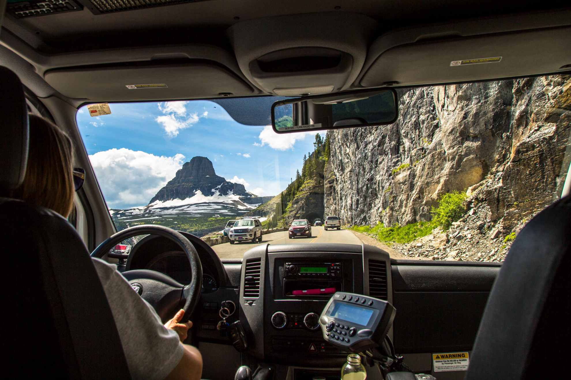 people driving in their cars on going to the sun road in Glacier