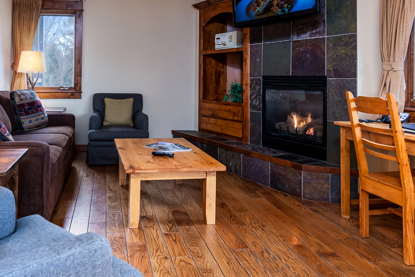 Cozy up next to the fireplace in this spacious one bedroom Lakefront Suite – Michael Klippert