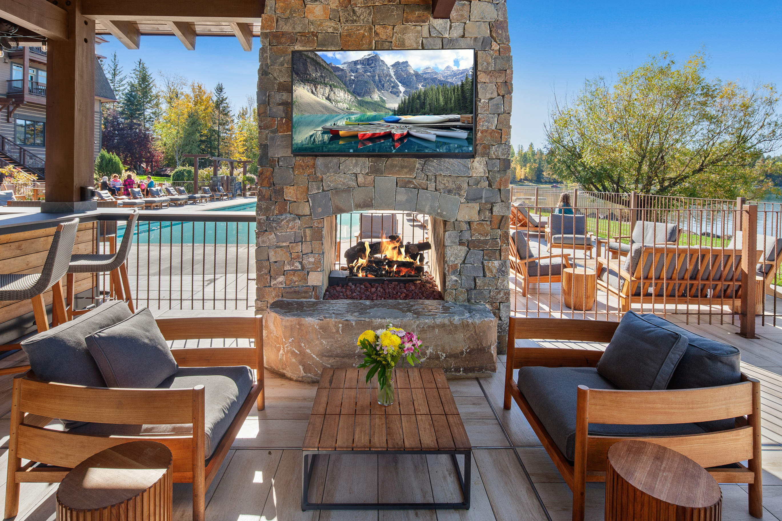 The dual fireplace at The Tiki Bar offers comfortable seating bar-side AND pool-side! – Glacier View Studio